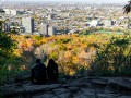 A_couple_sitting_on_top_of_Mount-royal_looking_at_Montreal_.jpg